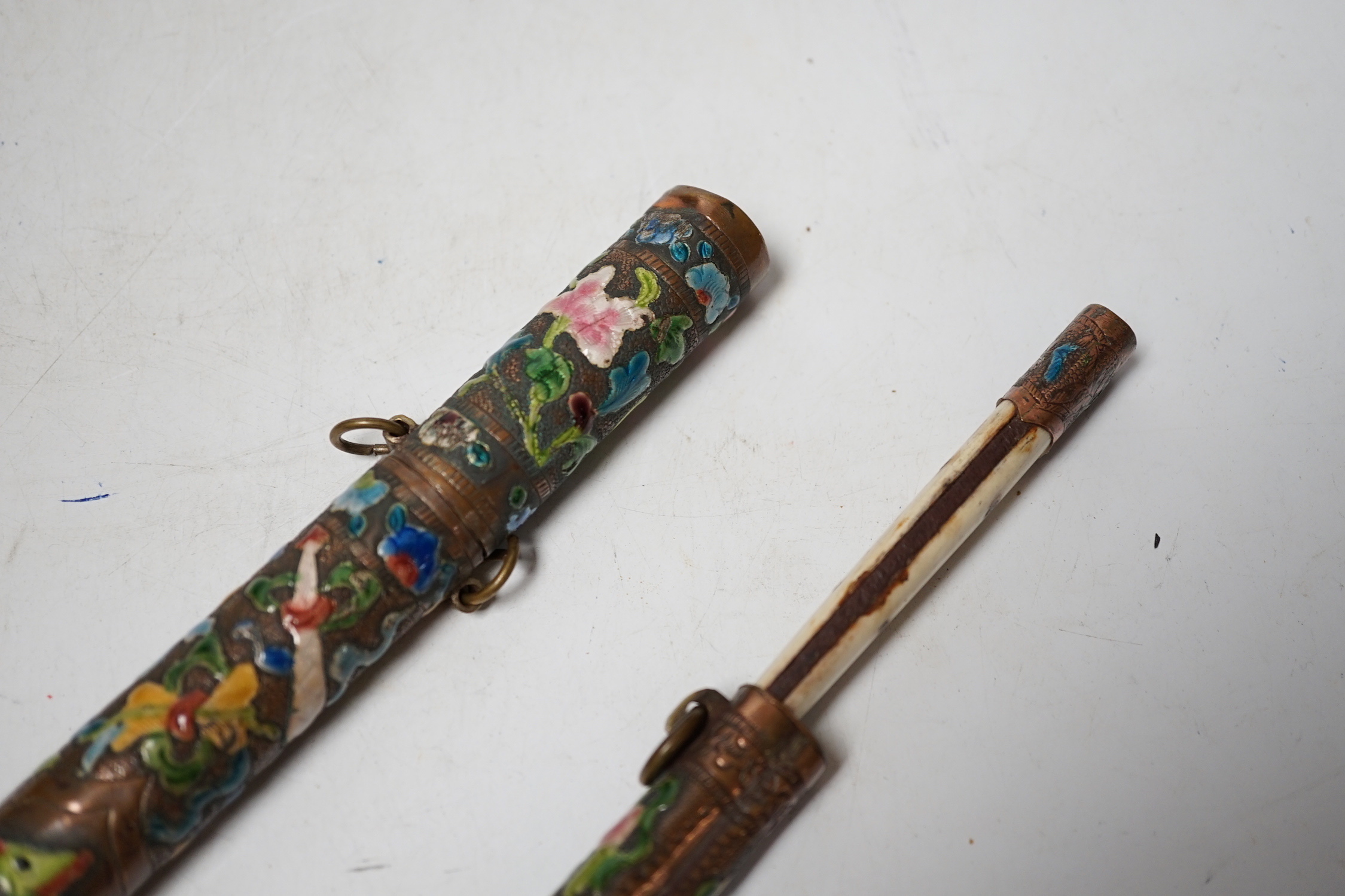 Two Chinese enamelled metal chopstick and knife cases, early 20th century, tallest 10.5cm high